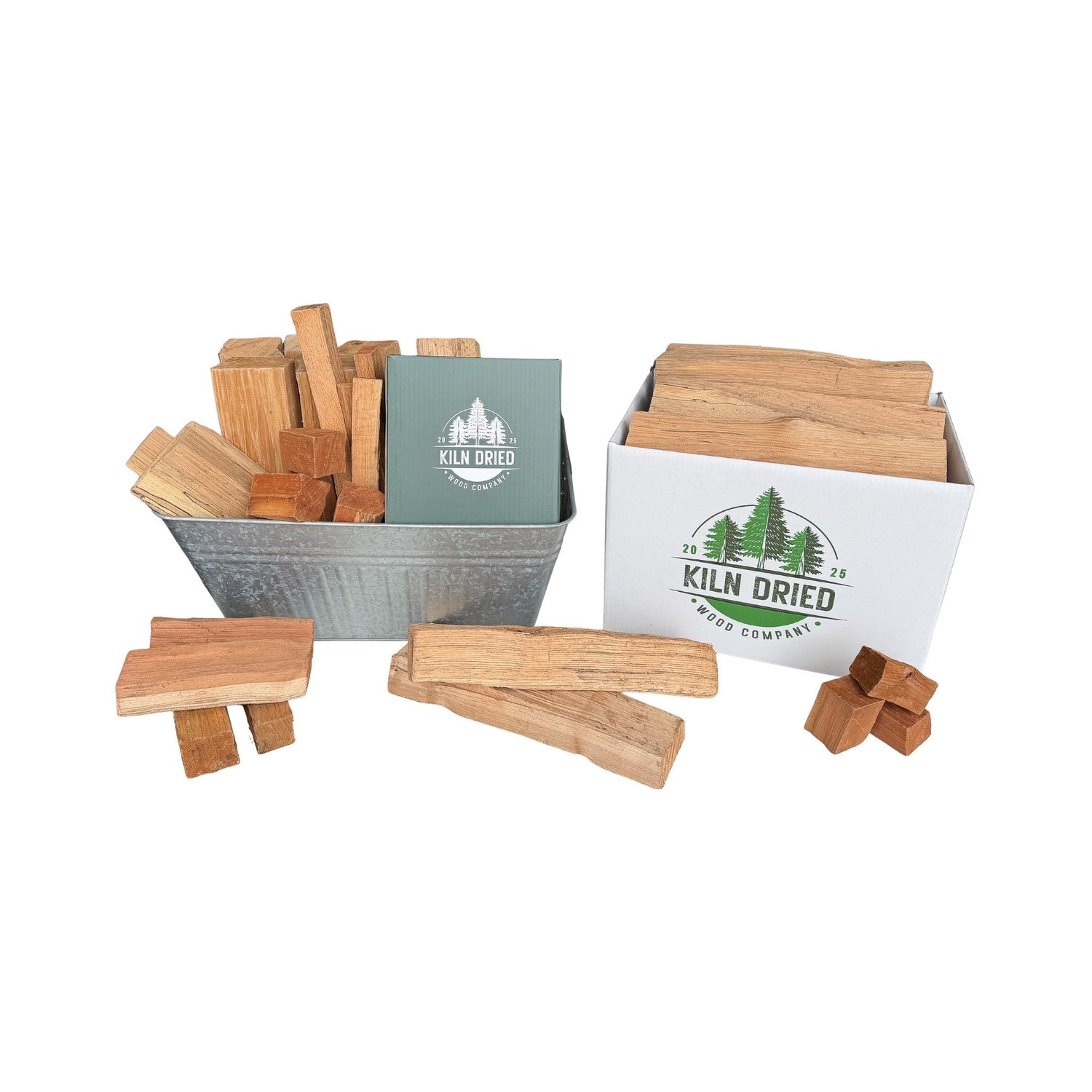 Kiln-dried cooking wood collection with boxed wood splits and chunks from Kiln Dried Wood Company on white background for BBQ, smokers, grills, and wood-fired cooking