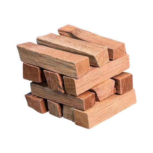 Close-up of 6-inch kiln-dried oak cooking wood splits on white background for smokers, grills, pizza ovens, and outdoor cooking